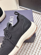 Black Dior unisex sneaker side view with sock collar and white sole
