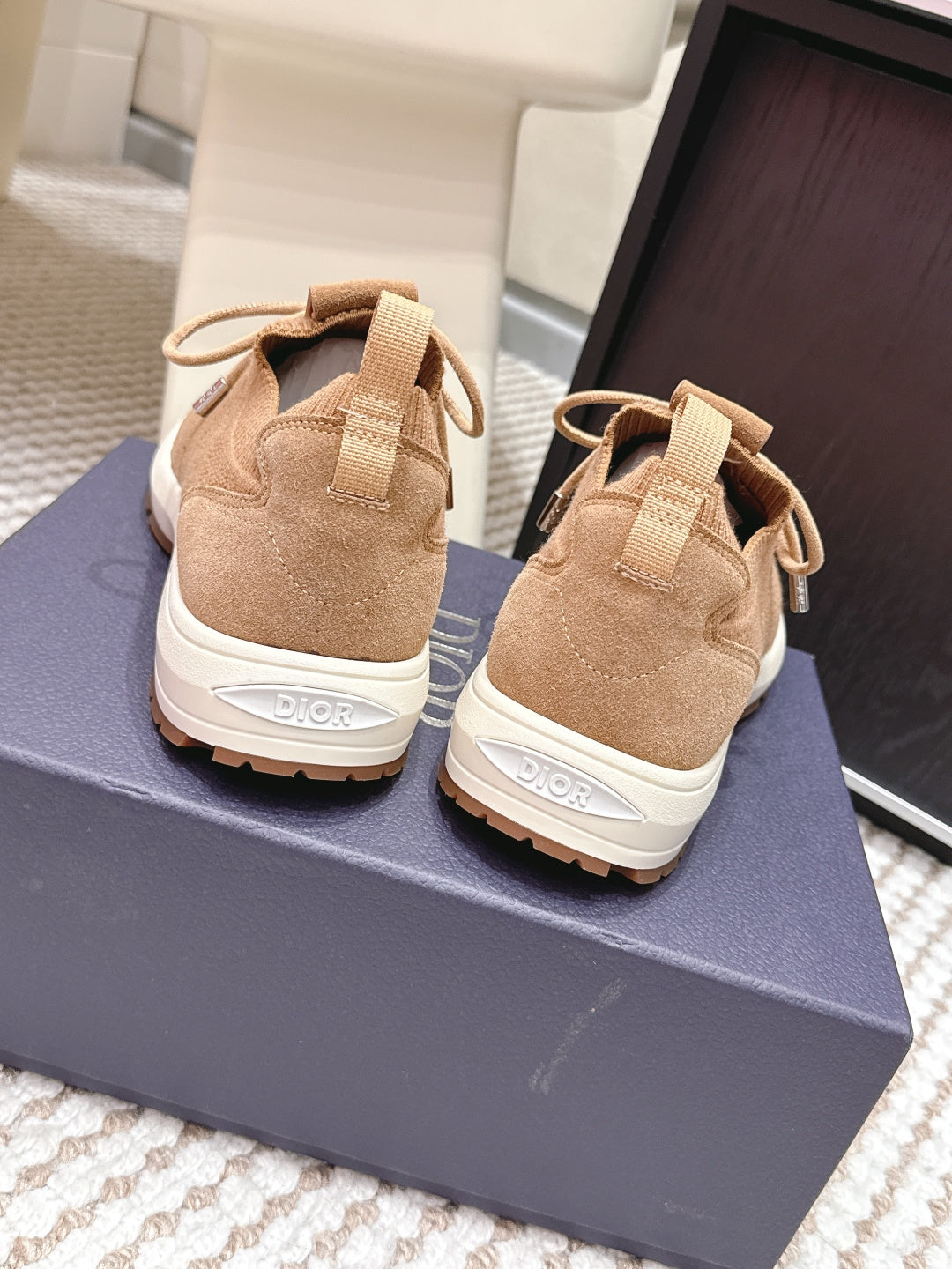 Beige Dior sneakers back view, heel pull tabs and lace-up with white sole