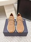 Beige knit Dior sneakers with lace-up front, cushioned soles and logo patch
