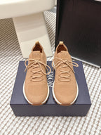 Beige knit Dior sneakers with lace-up front, cushioned soles and logo patch