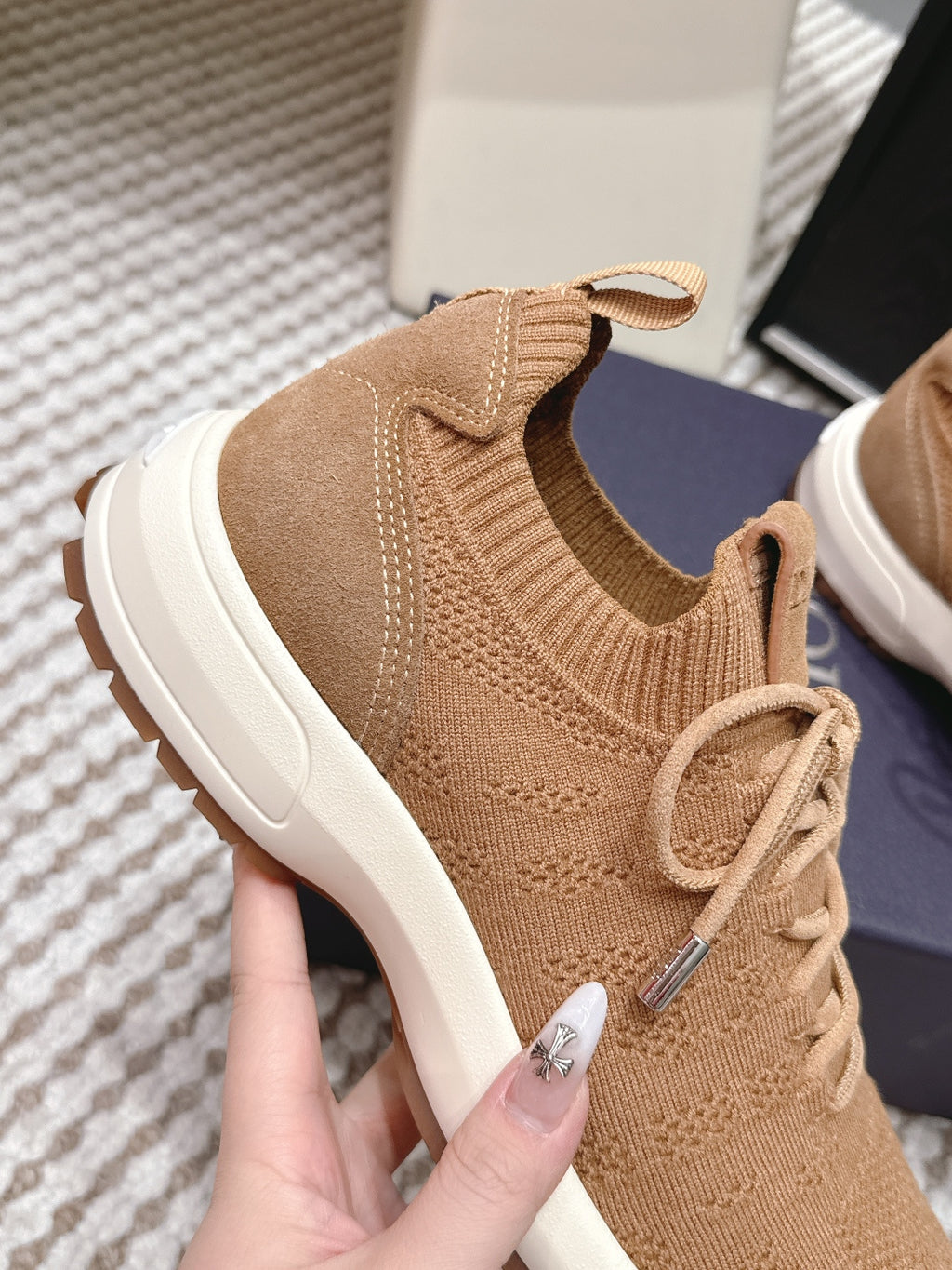 Beige Dior knit sneaker upper detail, elastic collar and lace-up with white midsole