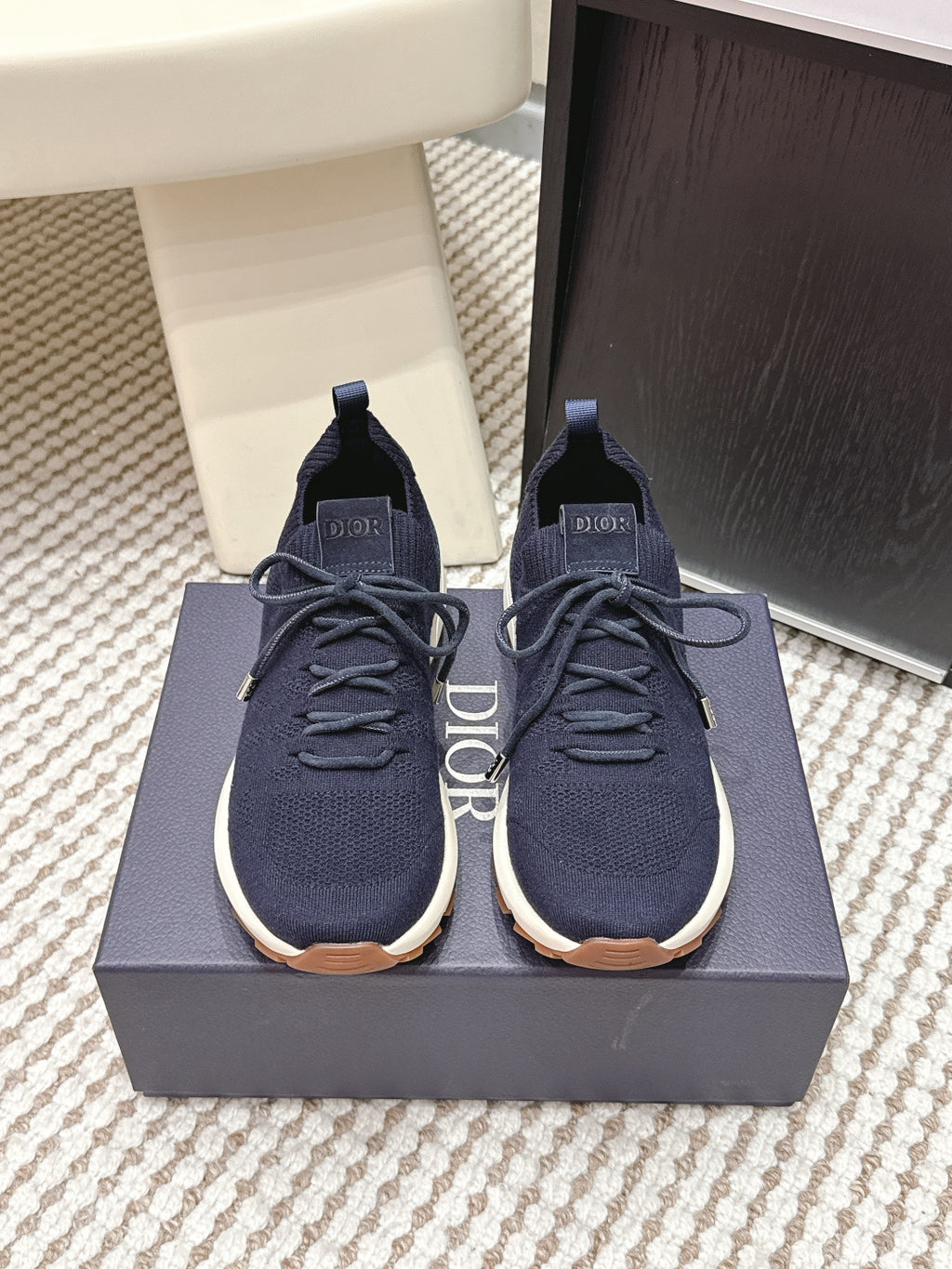 Navy knit unisex sneakers with lace-up front, white rubber sole, Dior logo tab