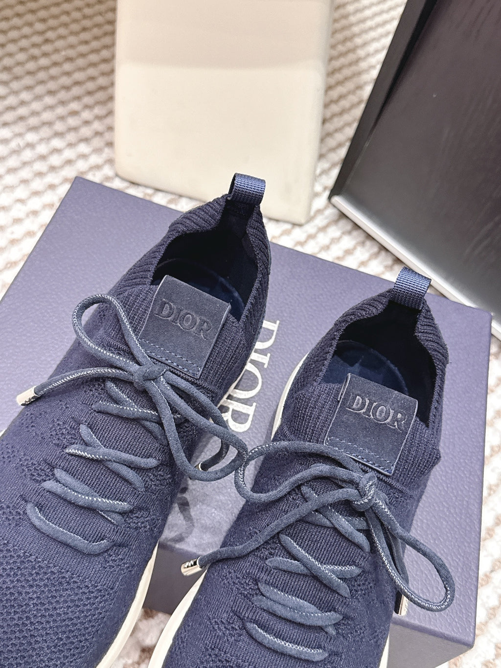 Navy knit lace-up sneakers with Dior logo patch and cushioned white sole