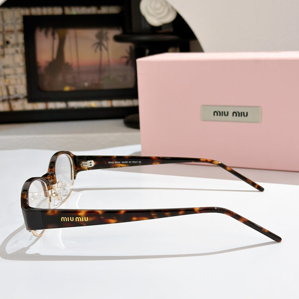 Miu miu eyeglasses with brown tortoiseshell front and clear lenses, slim arms