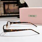 Miu miu eyeglasses with brown tortoiseshell front and clear lenses, slim arms