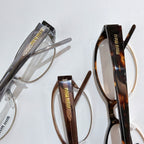 Assorted Miu miu eyeglasses: light silver frame and dark tortoiseshell frame, clear lenses