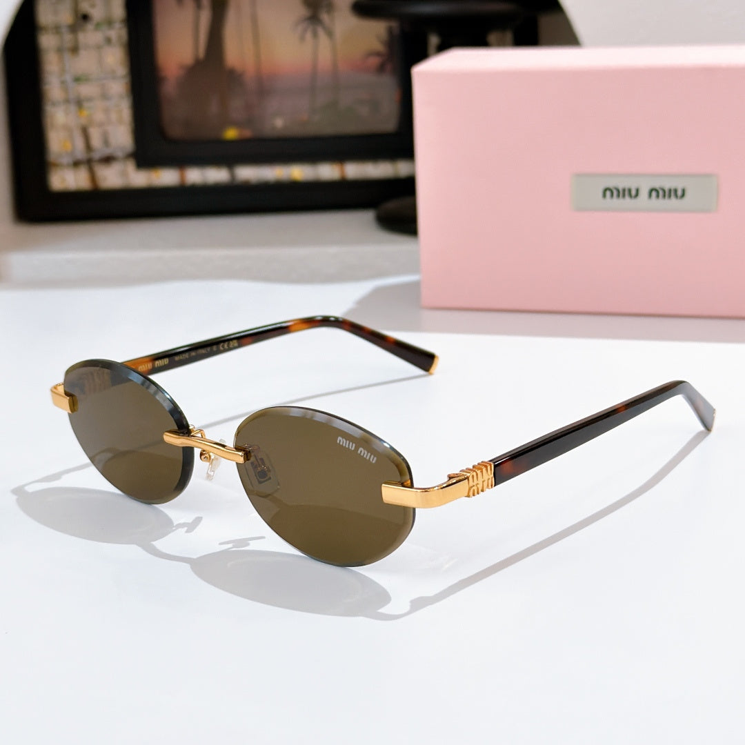 MiuMiu sunglasses with dark amber lenses, tortoiseshell frames and gold temples