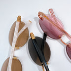 MiuMiu sunglasses assortment with clear, black and pink frames with gold temples