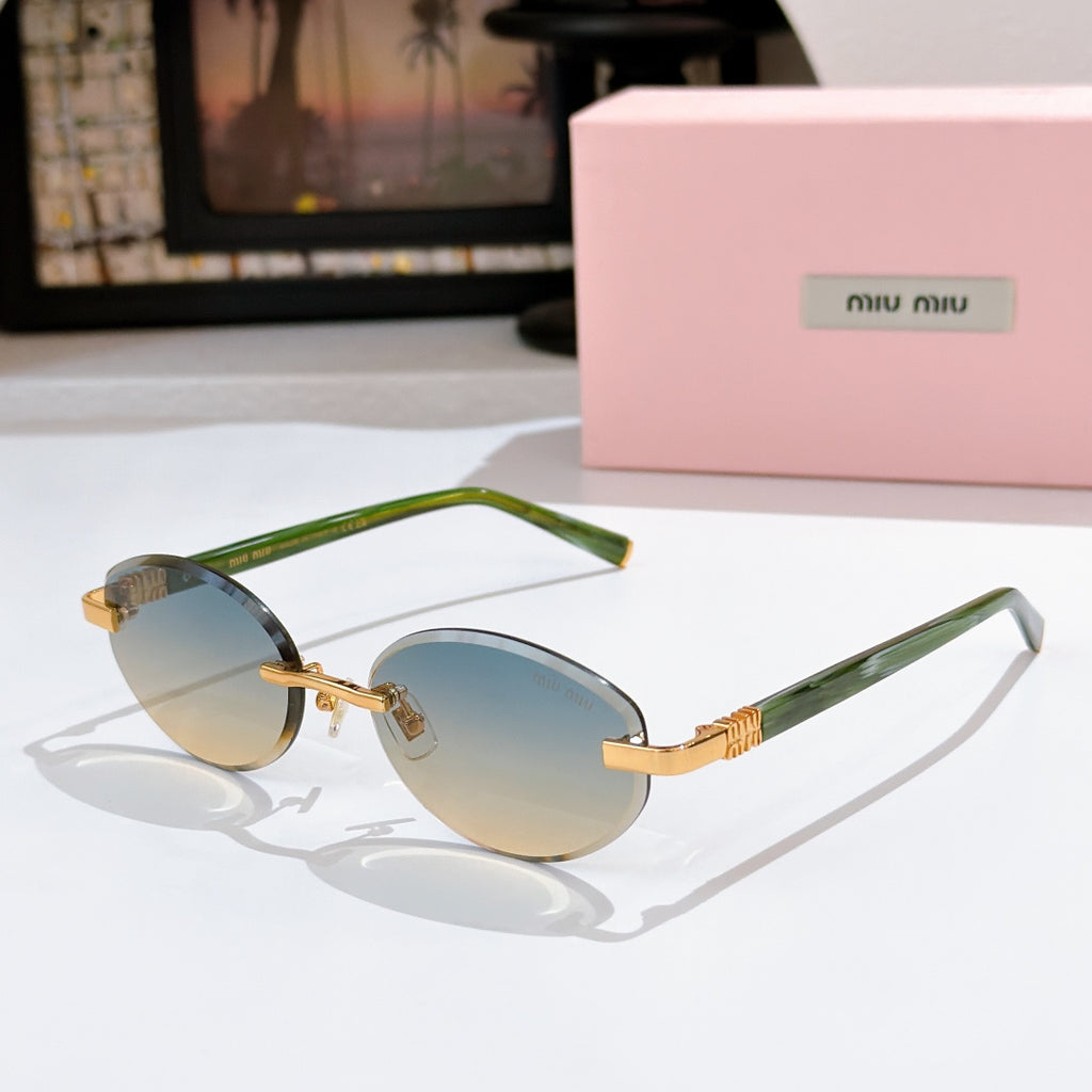 MiuMiu sunglasses with light blue lenses, green frames and gold decorative temples