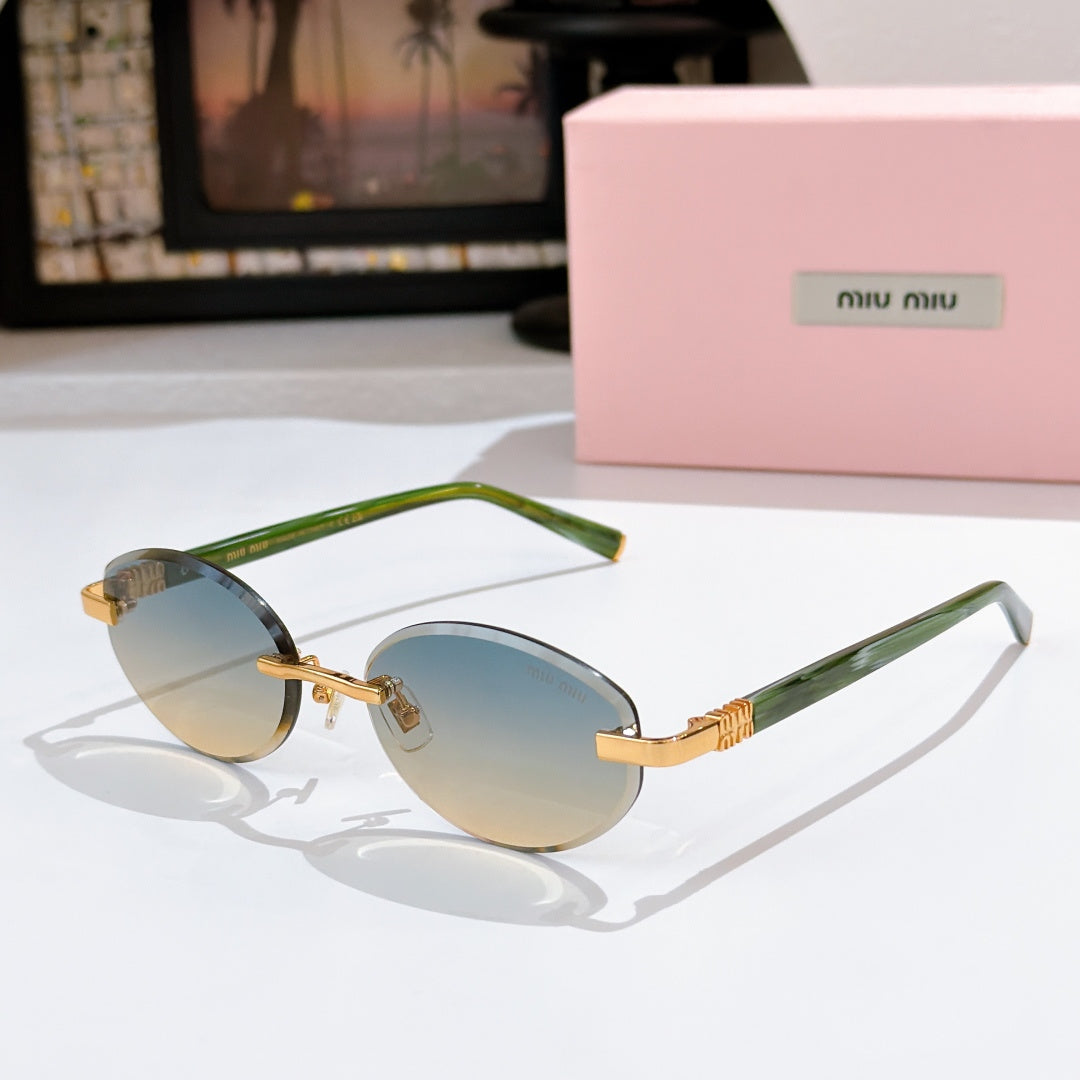 MiuMiu sunglasses with light blue lenses, green frames and gold decorative temples
