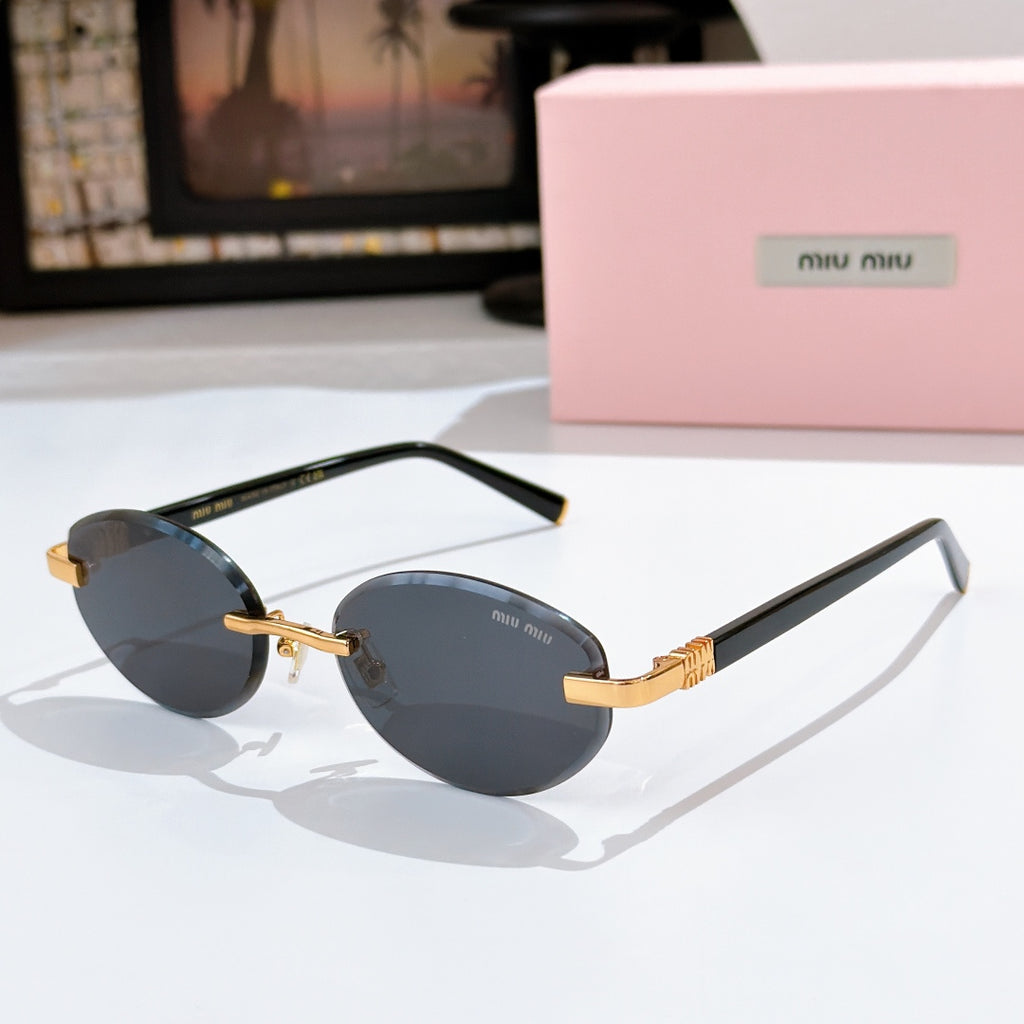 MiuMiu sunglasses with dark gray lenses, black frames and gold logo temples