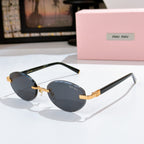 MiuMiu sunglasses with dark gray lenses, black frames and gold logo temples