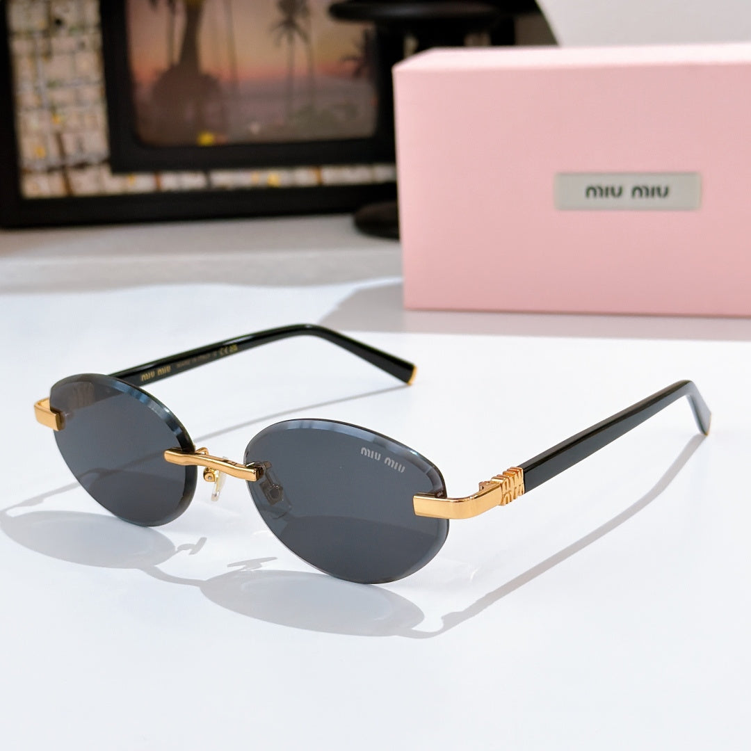 MiuMiu sunglasses with dark gray lenses, black frames and gold logo temples