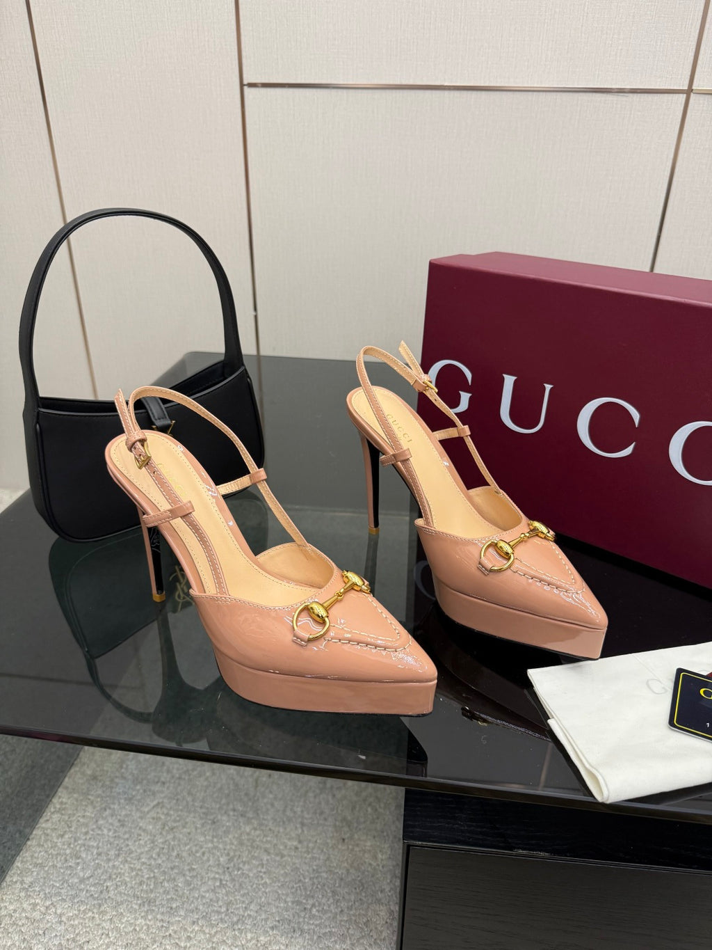 Beige slingback platform pumps with gold-tone buckle detail and stiletto heel