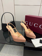 Beige slingback platform pumps with gold-tone buckle detail and stiletto heel