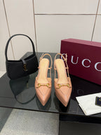Beige slingback platform pumps with gold-tone buckle detail and high stiletto heel