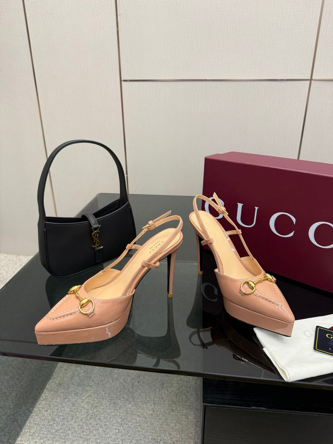 Beige slingback platform pumps with gold-tone buckle and thin stiletto heel