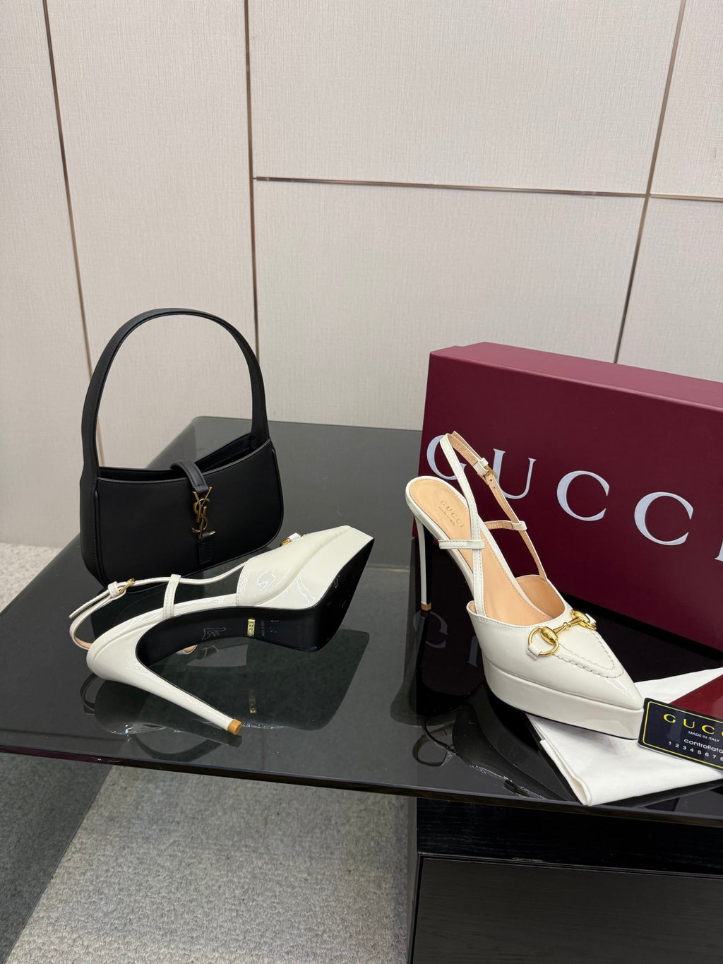 White Gucci slingback heels with gold hardware and slim stiletto heel