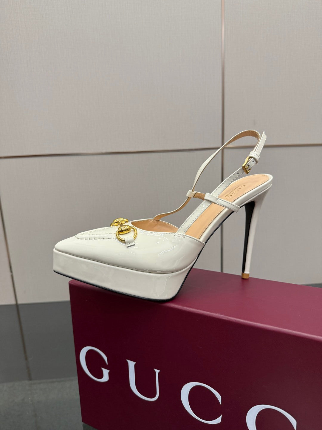 White Gucci slingback heels with gold buckle strap detail