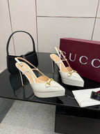 White Gucci slingback platform heels with gold strap detail