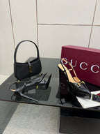 Gucci ladies black slingback heels, gold chain strap, patent finish