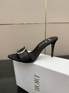 Black studded mule sandal with silver buckle and high stiletto heel