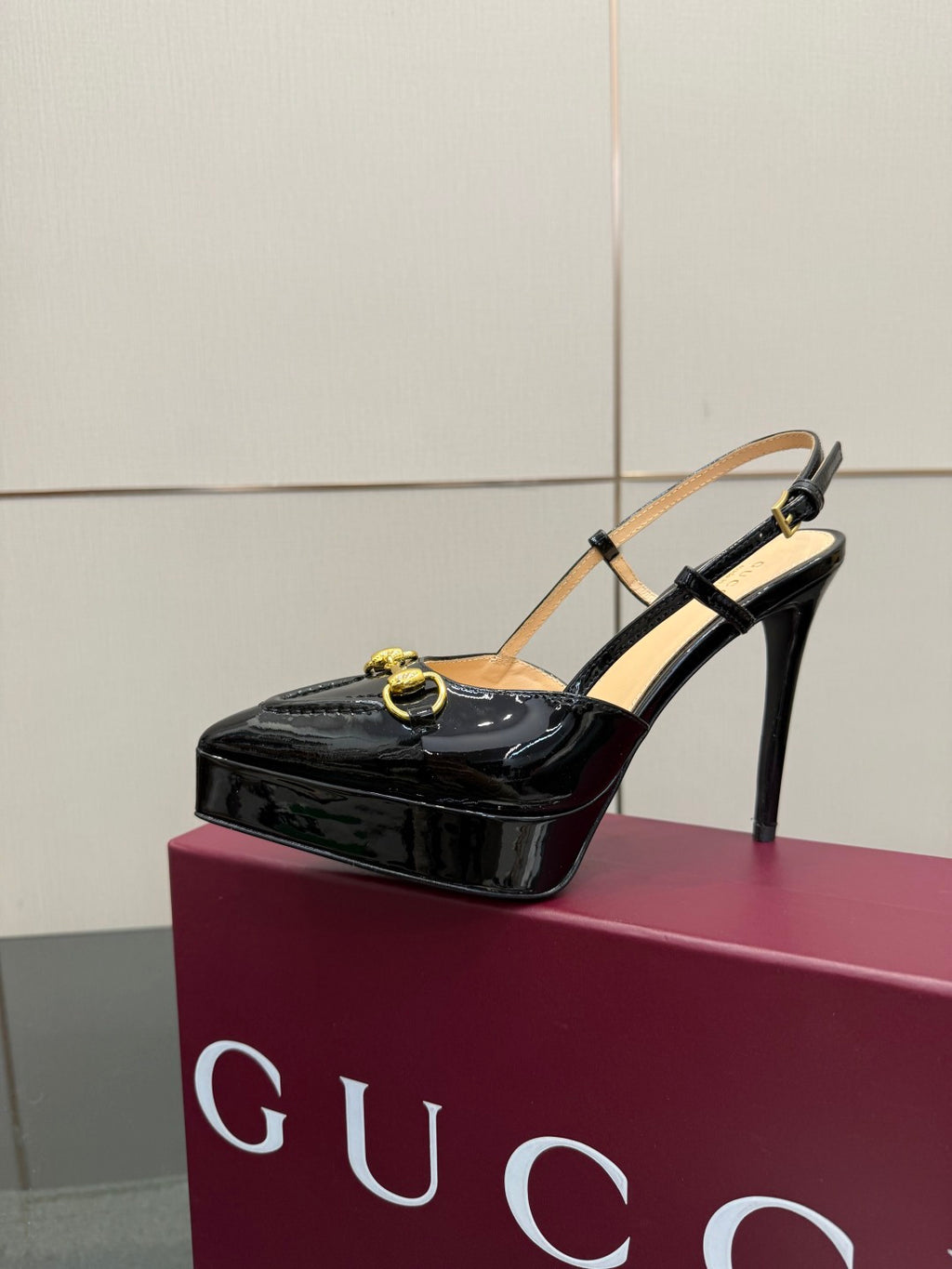 Gucci ladies black patent slingback heel with thin ankle strap and gold chain