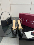 Gucci ladies black slingback heels, gold chain buckle detail, stiletto heel