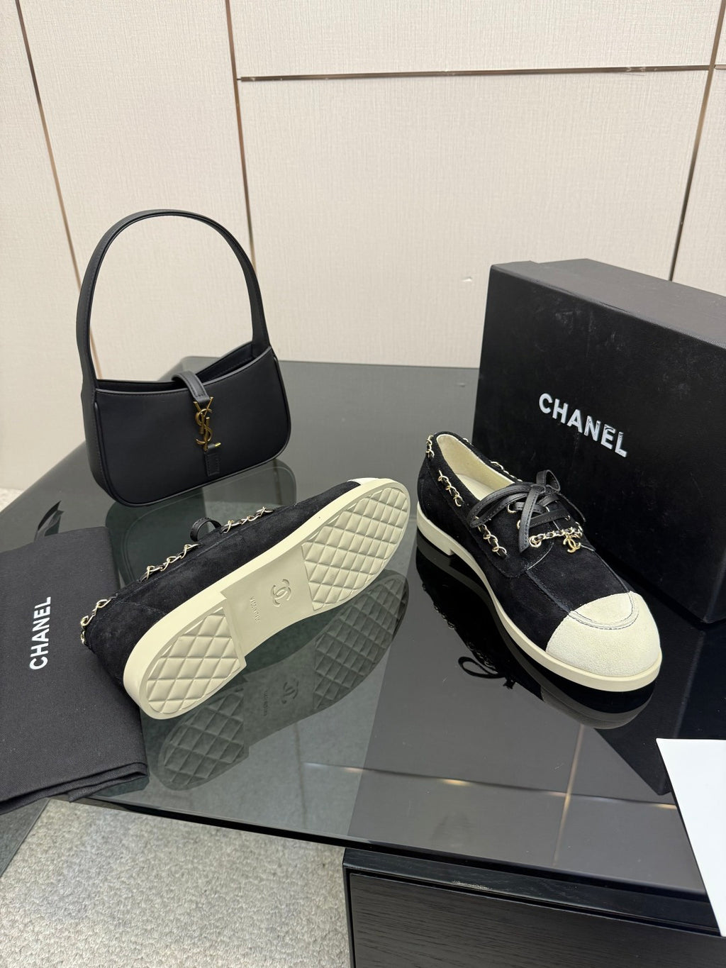 Chanel women’s sneakers with quilted outsole and lace-up dark upper