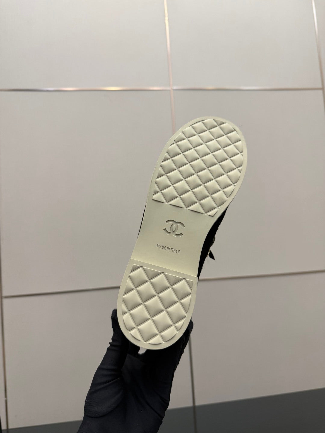 Chanel women’s sneaker outsole, white quilted tread with Chanel logo