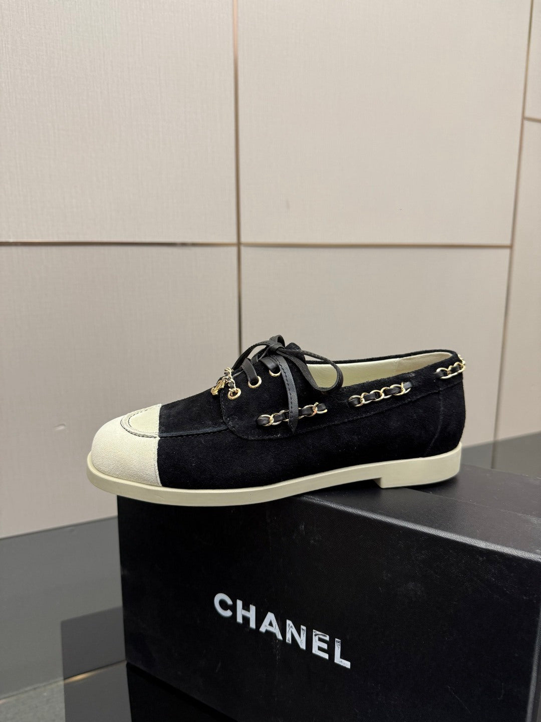 Chanel women’s lace-up sneakers, dark fabric with white toe panel and gold chain trim
