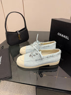 Chanel women's light-blue canvas sneakers, lace front and side trim detail