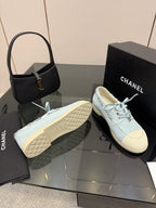 Chanel women's light-blue sneakers with textured outsole and lace-up upper