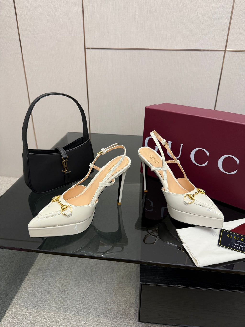 White Gucci slingback heels with gold chain ornament and stiletto heel