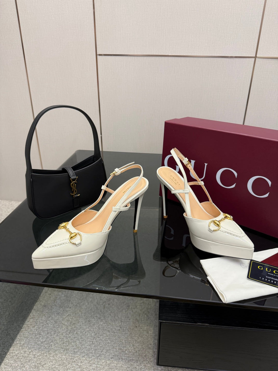 White Gucci slingback heels with gold chain ornament and stiletto heel