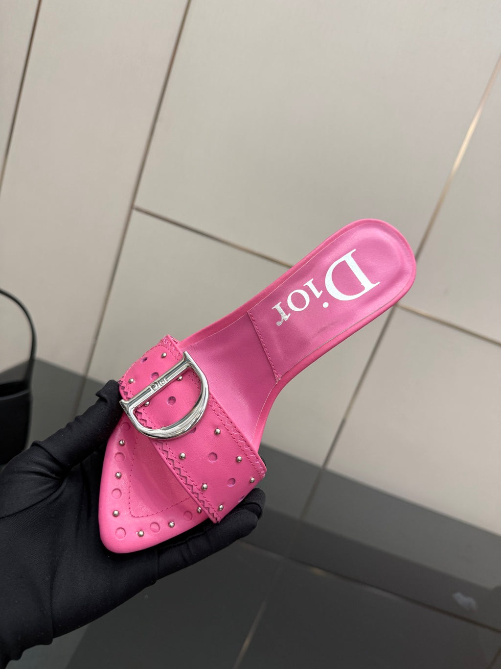 Dior ladies pink mule with buckle strap, showing brand on insole
