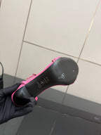 Pink Dior ladies sandal outsole bottom view, grip texture with small logo markings.
