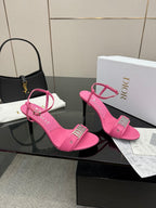 Pink Dior ladies heeled sandals with ankle strap and buckle detail, angled view of pair.