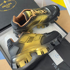 Prada unisex lace-up sneakers with metallic gold front and black textured side panels
