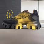 Prada unisex lace-up sneaker side view with metallic gold upper and black platform
