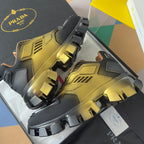 Prada unisex sneakers with metallic gold tops and black side straps over lug sole