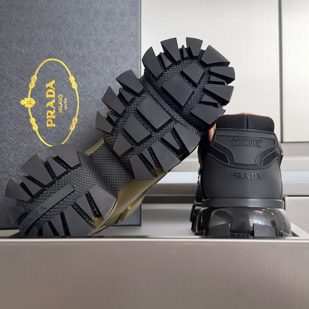 Prada unisex sneakers with black textured outsole featuring deep traction lugs