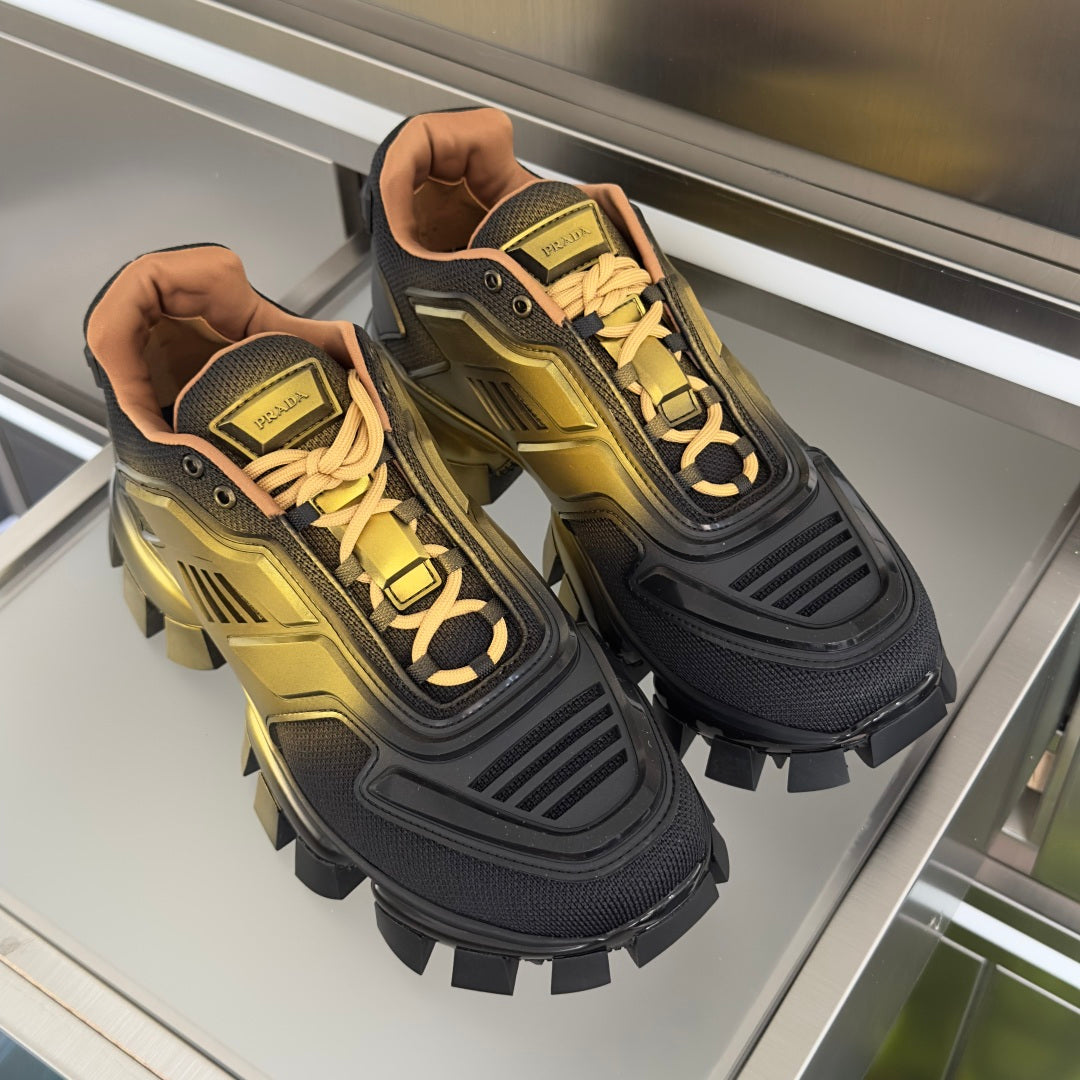 Pair of Prada unisex lace-up sneakers, metallic gold and dark gray with lug soles