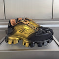 Prada unisex lace-up sneakers with metallic gold panels and chunky black lug sole