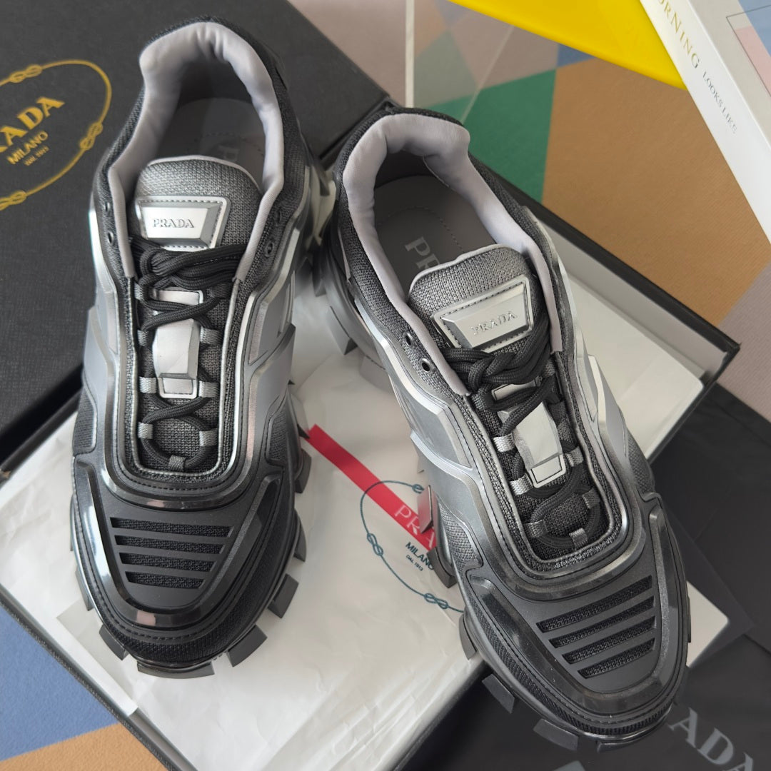 Prada unisex chunky sneakers, silver and black with lace-up uppers, close front