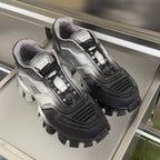 Prada unisex chunky sneakers, silver and black, front view on display tray