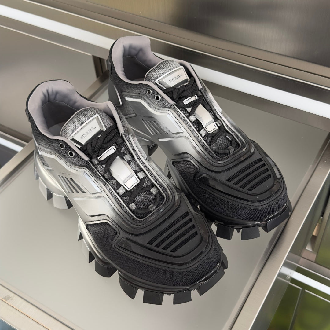 Prada unisex chunky sneakers, silver and black, front view on display tray