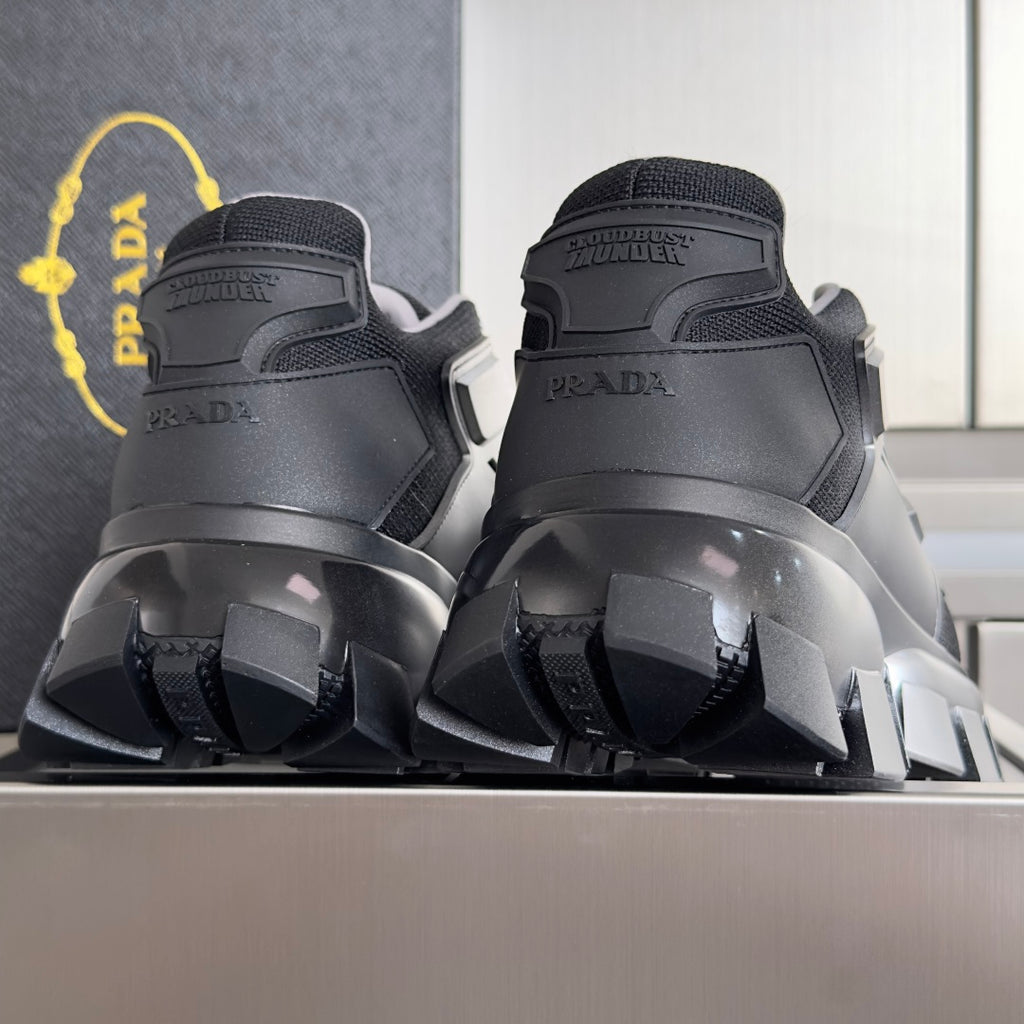 Prada unisex chunky sneakers, dark back view with molded heel logo