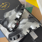 Prada unisex chunky sneakers, angled view of lace-up fronts and studded sole