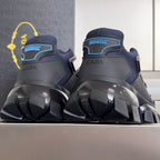 Unisex sneakers with dark blue uppers, PRADA branding, and black heel tread.
